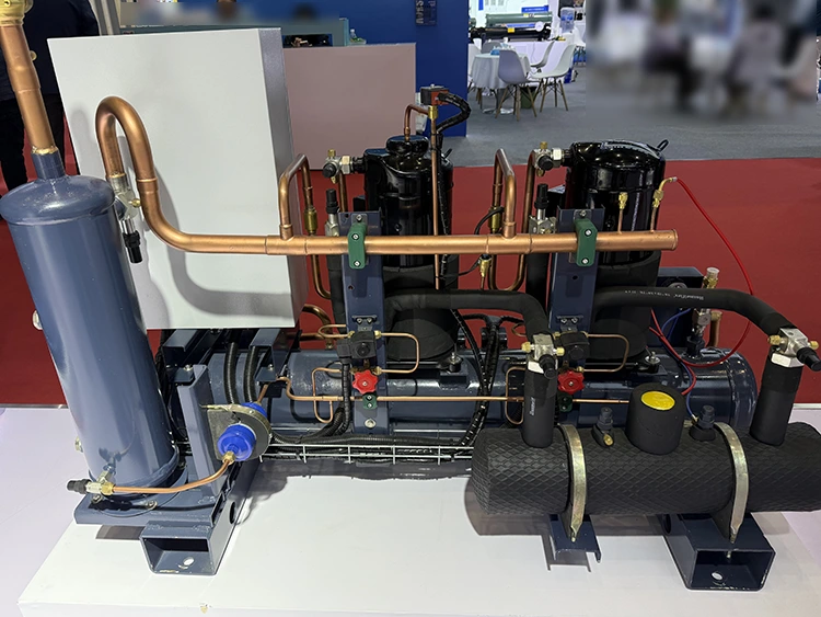Water cooled scroll refrigeration system for industrial applications